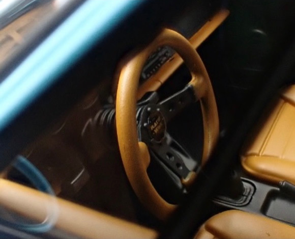The model’s steering wheel and interior details.