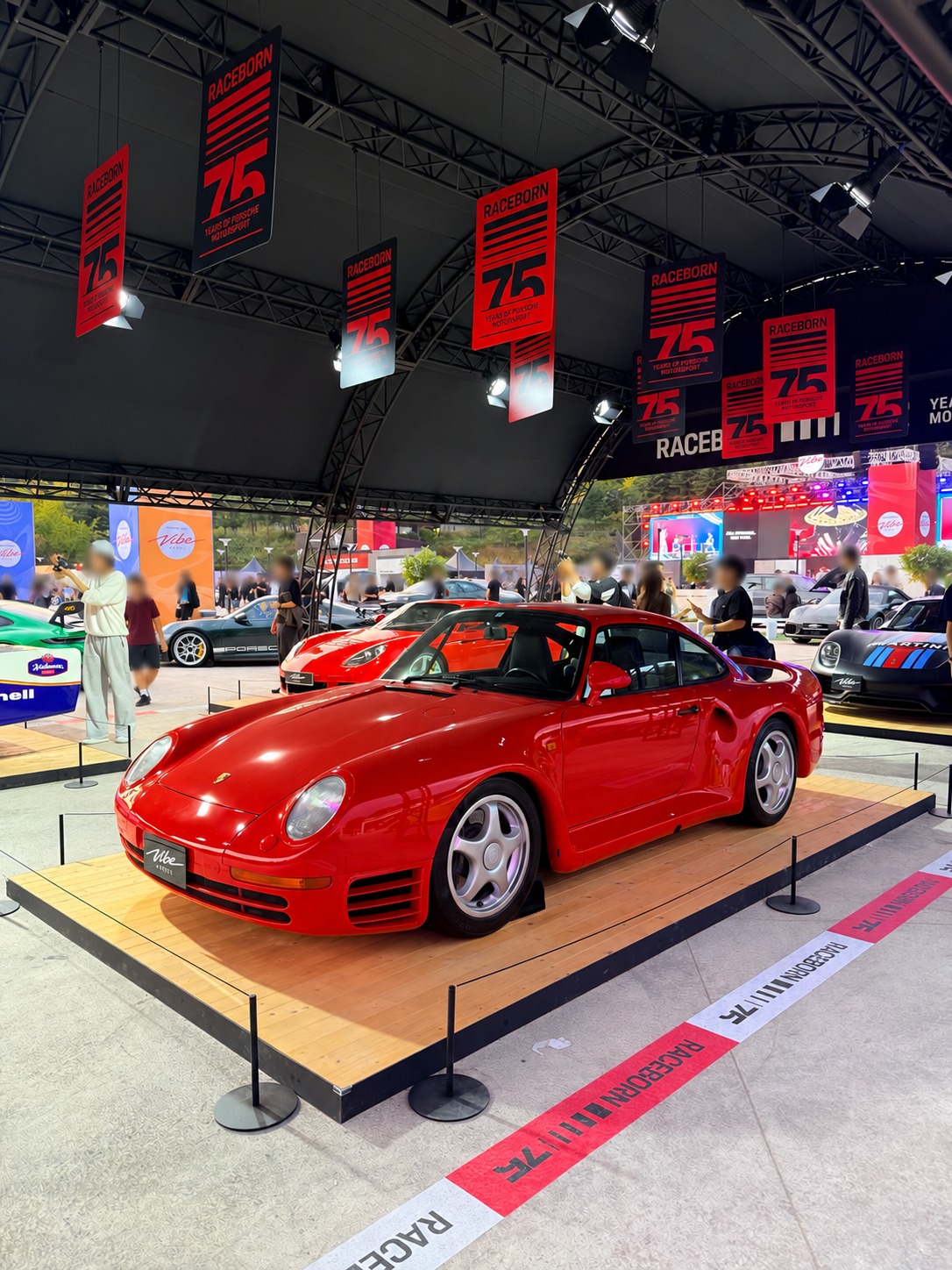 A red Porsche 959 in the motorsport display.