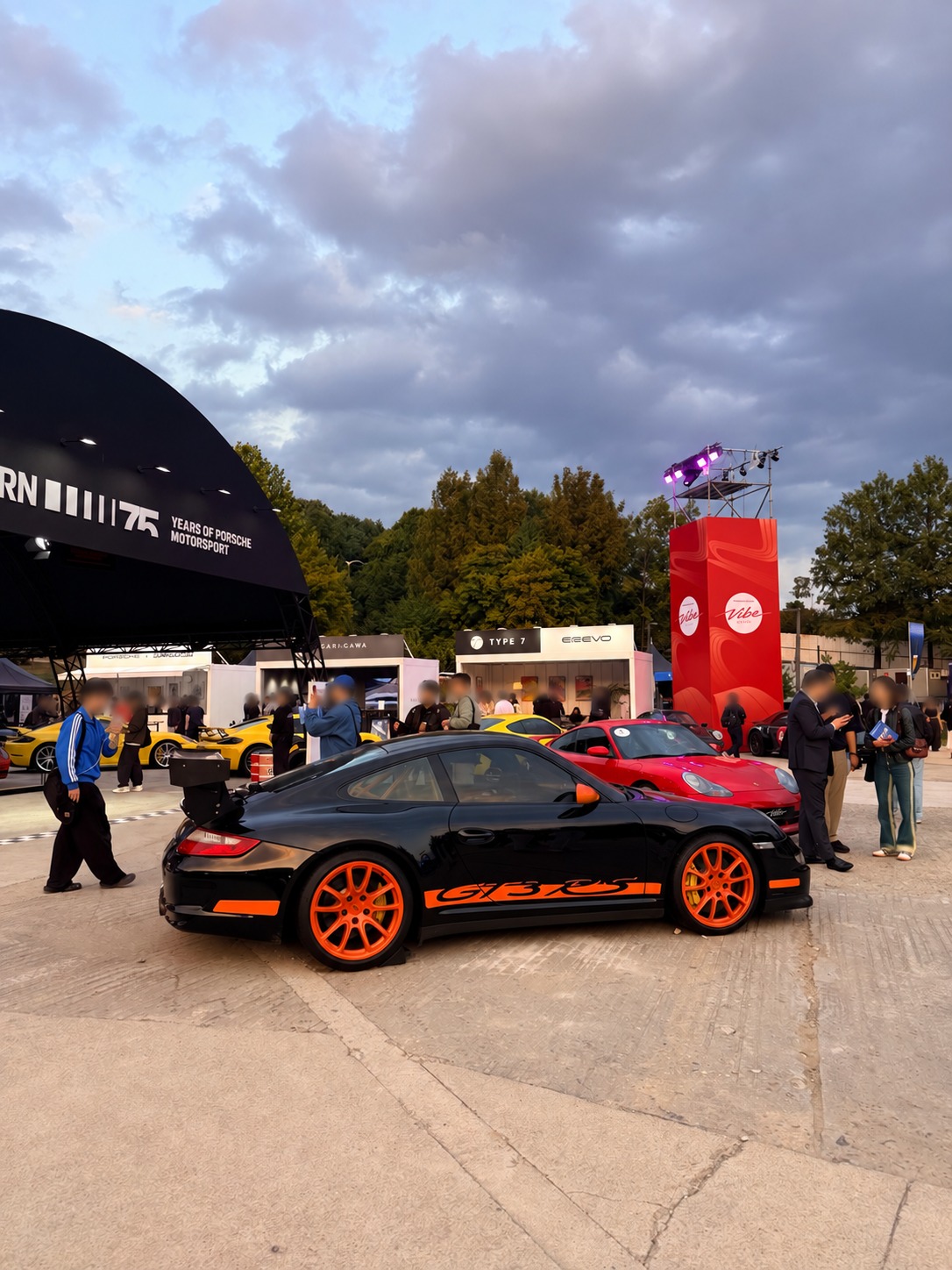 A black and orange GT3 RS at the gathering.